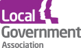 LGA, Local Government Association, logo. The word local is in white text on a purple background. The words Government and Association are in grey text below. There is three illustrated side portrait faces in the logo.