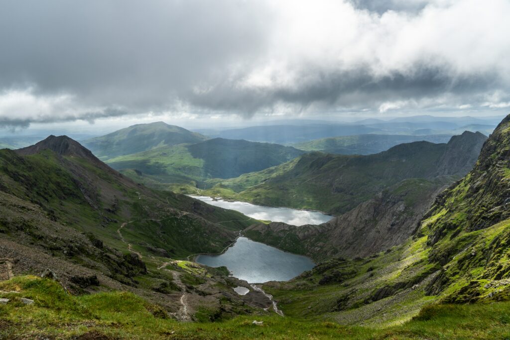 Photo by josh Kirk of Snowdon valley with clouds in the day light